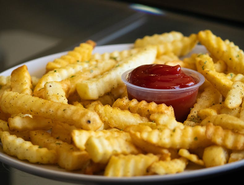 Seasoned crinkle-cut fries with Wing Snob spice blend